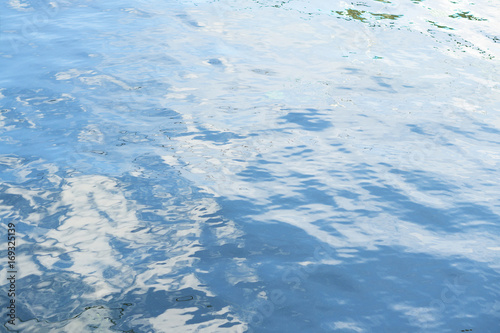 calm blue surface of river water with ripples