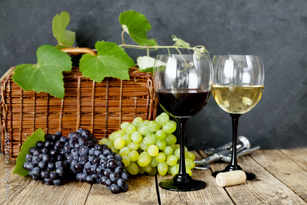 Glasses with white and red wine on black background