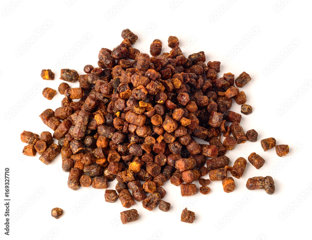 Granules of bee bread isolated on a white background. Apitherapy. Beekeeping products. Strengthening immunity. Granules of bee bread isolated on a white background. Apitherapy. Beekeeping products. Strengthening immunity.