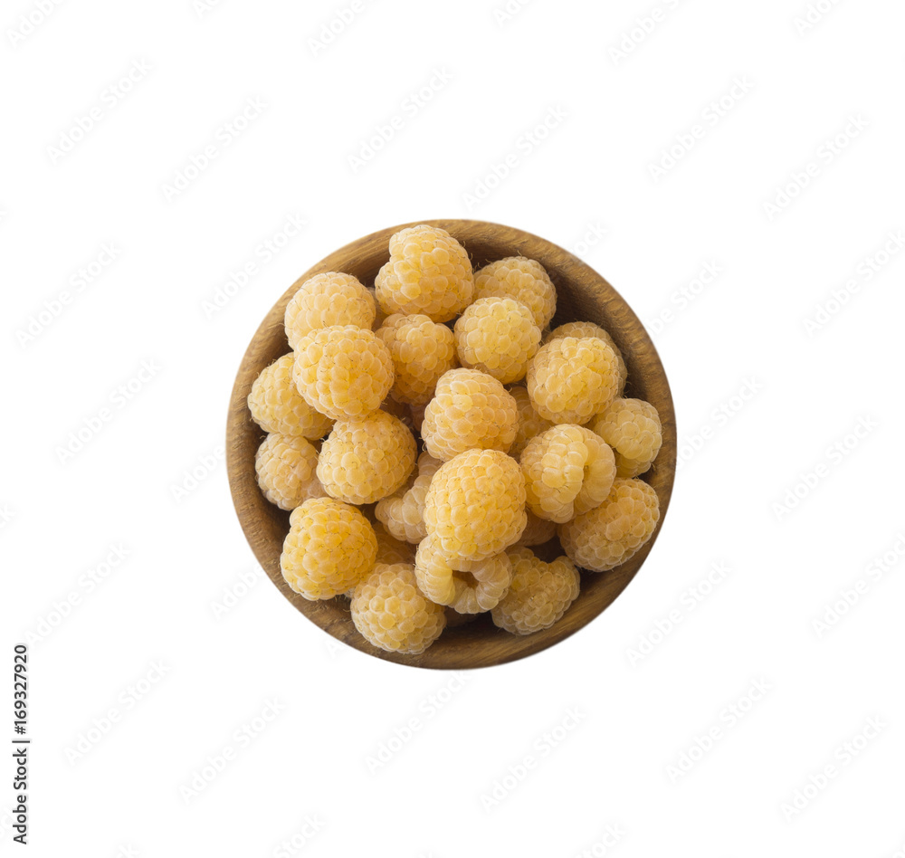 Raspberries in a wooden bowl isolated on white background. Vegetarian or healthy eating. Juicy and delicious yellow raspberry with copy space for text. Top view. Raspberries in a wooden bowl isolated on white background. Vegetarian or healthy eating. Juicy and delicious yellow raspberry with copy space for text. Top view.