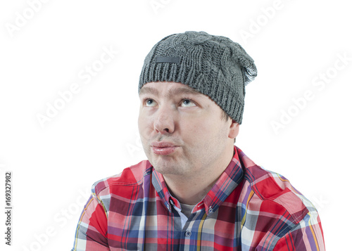 Caucasian man looking weird and funny with a hat on. The man isolated on white.