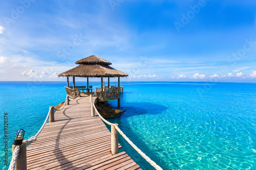 Fototapeta Naklejka Na Ścianę i Meble -  Beautiful summer tropical beach landscape, wooden pier, turquoise sea water