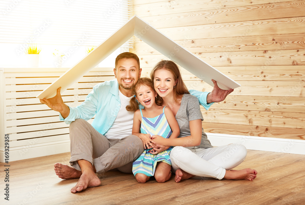 concept housing young family. Mother father and child in new house with roof concept housing young family. Mother father and child in new house with roof