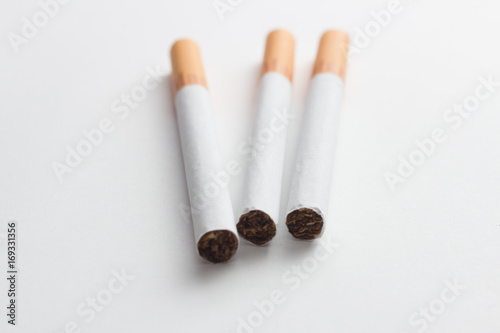 Close-up of a group of cigarettes on a white background photo