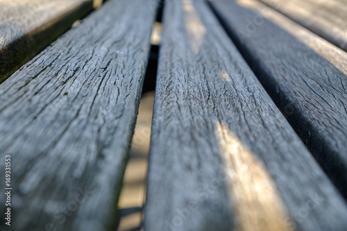 Light beams on wooden bench boards