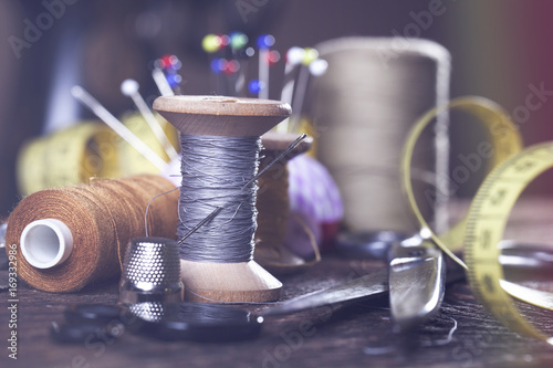 Obraz na plátne Sewing instruments, threads, needles, bobbins and materials.