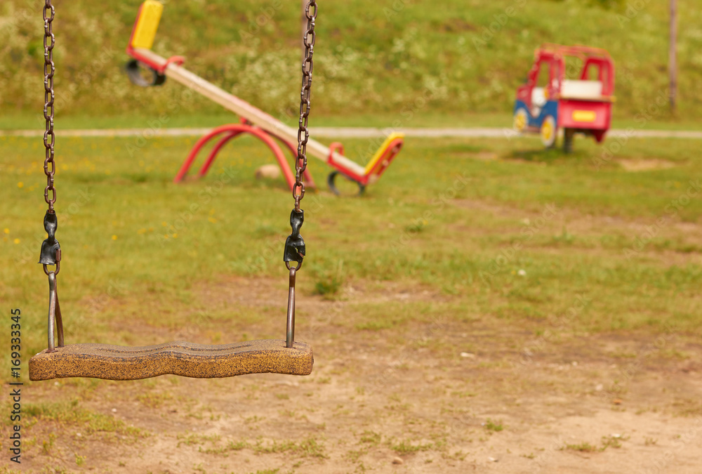 An empty playground with swings