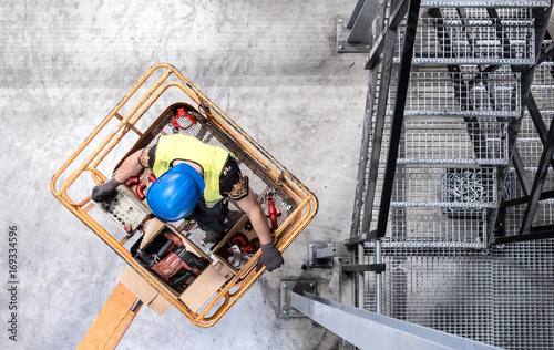 Aerial of a worker on a cherry picker photo
