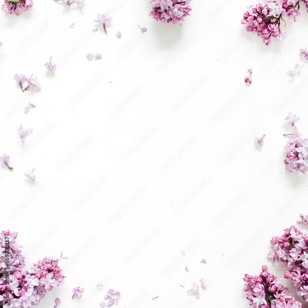 Frame of lilac flowers with space for text on white background. Flat lay, top view Frame of lilac flowers with space for text on white background. Flat lay, top view