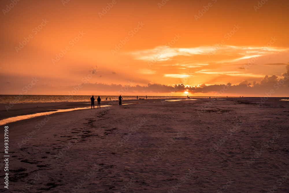 Sunset Walking down the beach 