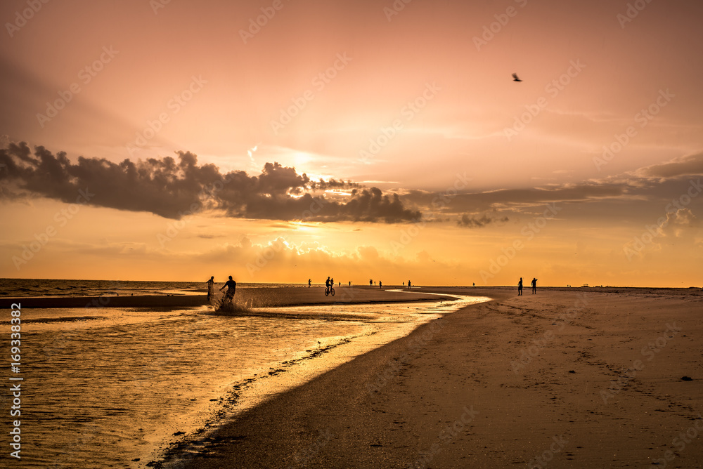 Sunset Walking down the beach 