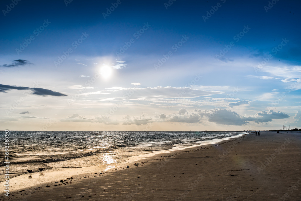 Sunset Walking down the beach 