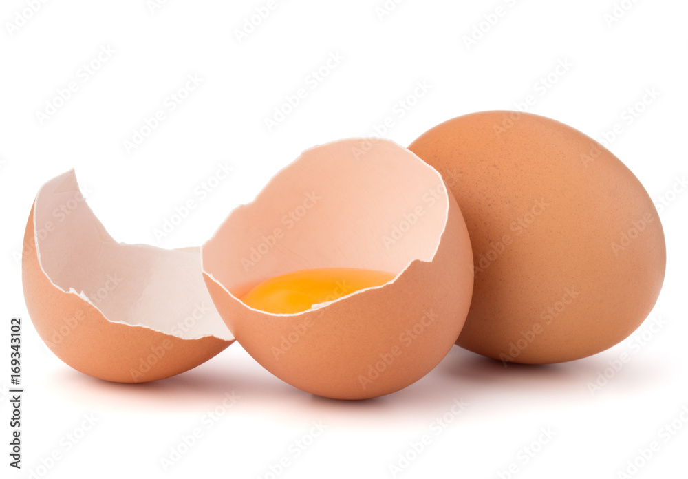 Broken egg in eggshell half and raw egg isolated on white background cutout Broken egg in eggshell half and raw egg isolated on white background cutout