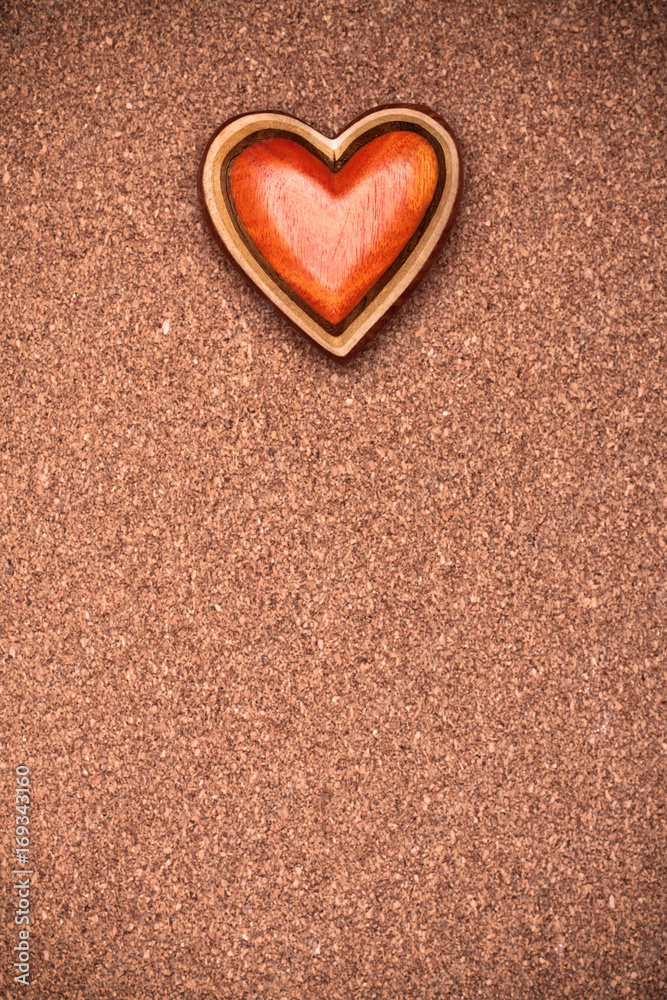 One wooden heart on rustic wood background. Valentines days concept.  Love symbol. Greeting card with copy space.