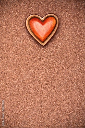 One wooden heart on rustic wood background. Valentines days concept.  Love symbol. Greeting card with copy space.
