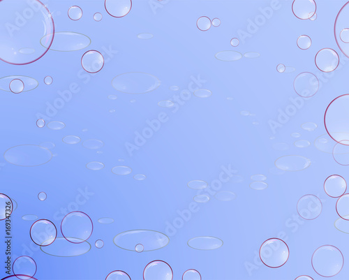 Soap bubbles with reflections on a blue background