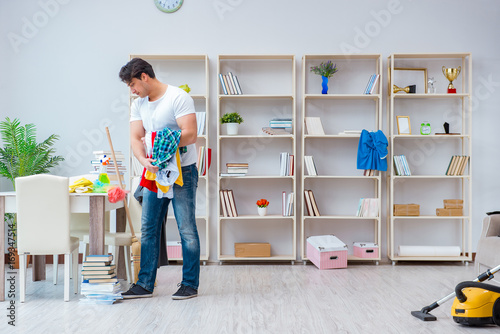 Фотография Man doing cleaning at home
