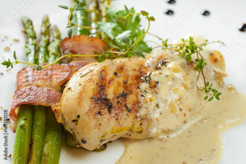 Chicken fillet with asparagus and sauce