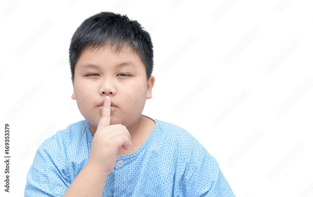Portrait of obese fat boy with finger on lips isolated Portrait of obese fat boy with finger on lips isolated
