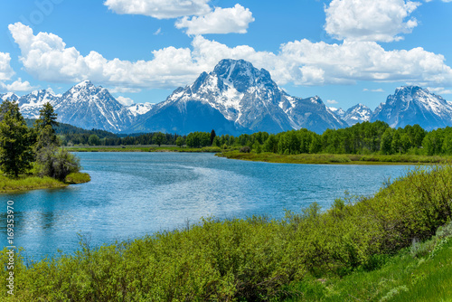 Mount Moran at Oxbow Bend of Snake River - Spring clouds passing over snow covered Mount Moran at Oxbow Bend of Snake River in Grand Teton National Park, Wyoming, USA.