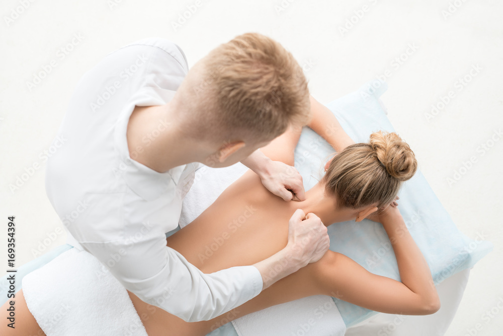 Top view of massagyst massaging pretty blonde Top view of massagyst massaging pretty blonde