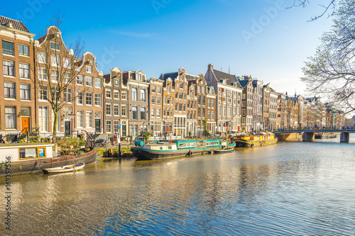 Dutch house style with the canal in Amsterdam city, Netherlands