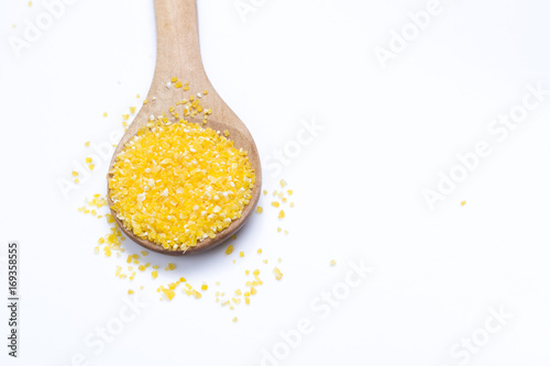 Raw organic Polenta Corn Meal Grits on the white background with copy space - healthy food ingredient.