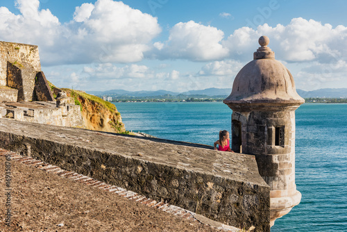 Puerto Rico travel people in Old San Juan, tourist woman visiting Castillo San Felipe del Morro Fortress, touristic attraction on cruise vacation destination. Summer holiday. photo