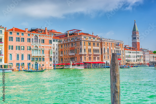 Views of the most beautiful canal of Venice - Grand Canal water streets, and Campanile of St. Mark's Cathedral (Campanile di San Marco). Italy. © BRIAN_KINNEY