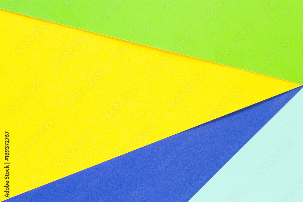 Colored papers geometry flat composition background with yellow, green and blue tones Colored papers geometry flat composition background with yellow, green and blue tones