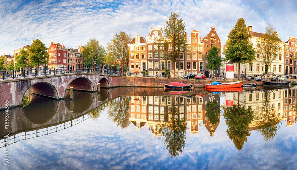 Fototapeta premium Amsterdam Canal houses vibrant reflections, Netherlands, panorama