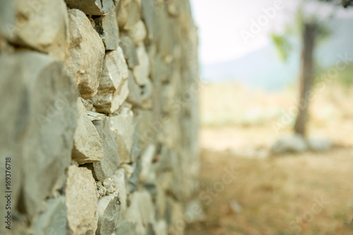 Old vintage stone wal with perspective view and blurred background