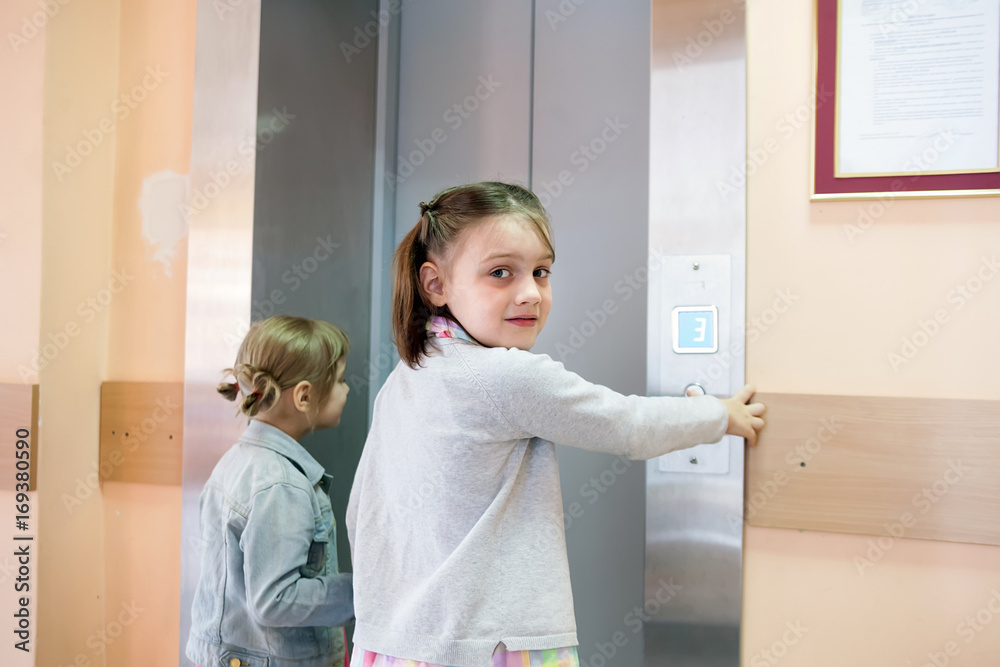 little girls causing elevator in high-rise building little girls causing elevator in high-rise building