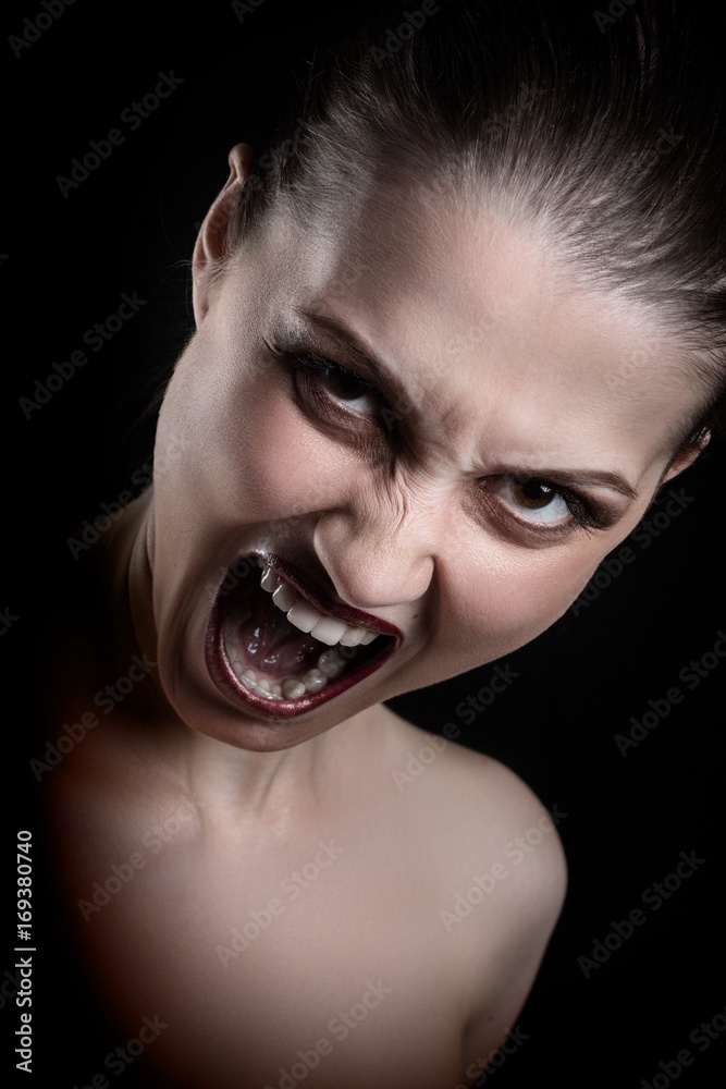 angry nude girl screaming at camera on black background angry nude girl screaming at camera on black background