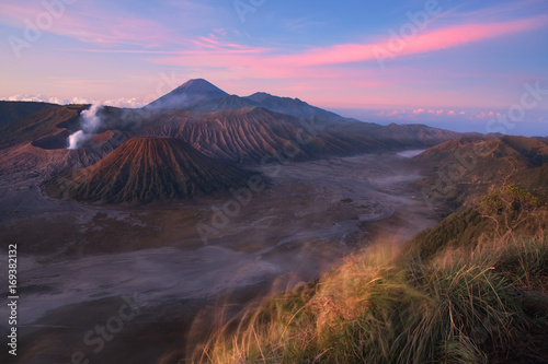 Mount Bromo volcano (Gunung Bromo) during sunrise from viewpoint on Mount Penanjakan. Mount Bromo located in Bromo Tengger Semeru National Park, East Java, Indonesia. pamorama.
