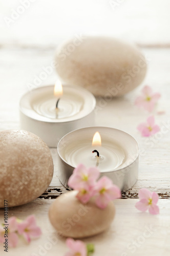 SPA still life with pebbles  flowers and aromatherapy candles