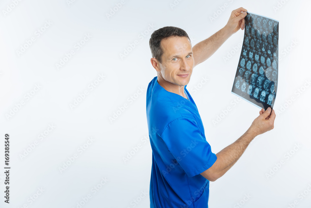 Side view on cheerful doctor with x ray scan Side view on cheerful doctor with x ray scan