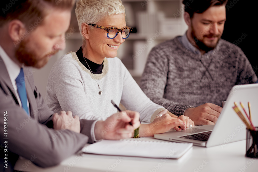 Team siting and having meeting or presentation in modern office Team siting and having meeting or presentation in modern office