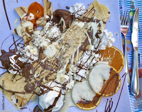 Pancakes with ice cream and fruits 