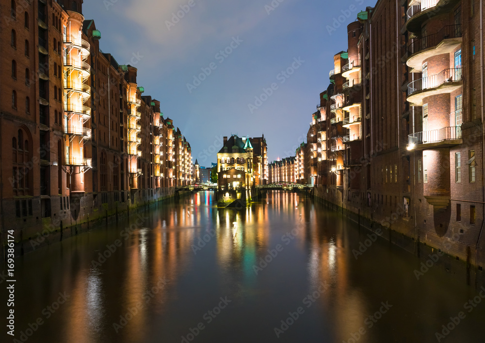 old warehouse district Speicherstadt in Hamburg, Germany illuminated at night