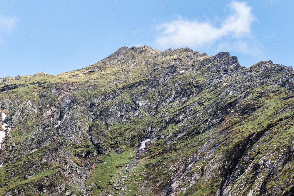 Mountain landscape of the high rocky Fagaras mountains in Carpathians, near the Transfagarasan road and balea lake, Romania