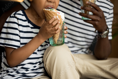 father and son eating ice cream