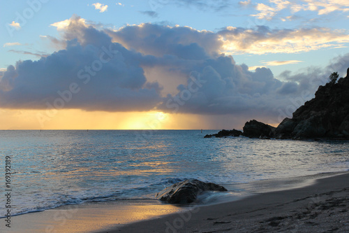 colorful sunset on st. Barts, french island, Shell beach in caribbean sea