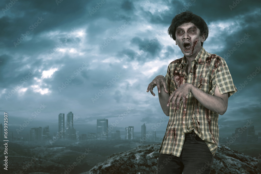 Scary asian zombie man with open mouth standing Scary asian zombie man with open mouth standing