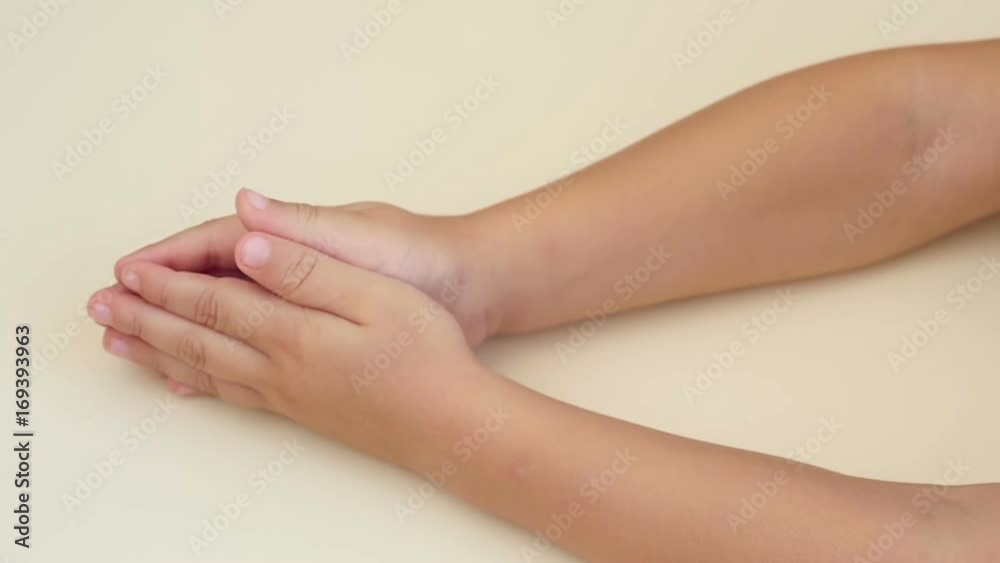 Hands of a child close-up on a white background. Hands of a child close-up on a white background.