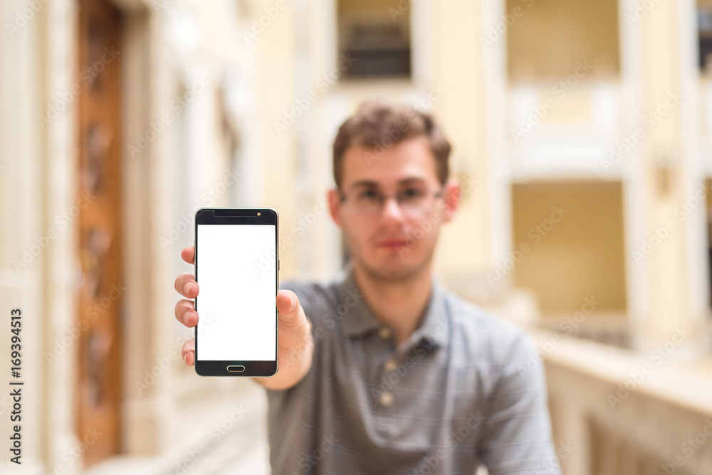 Man hand holding smart phone with white screen Man hand holding smart phone with white screen