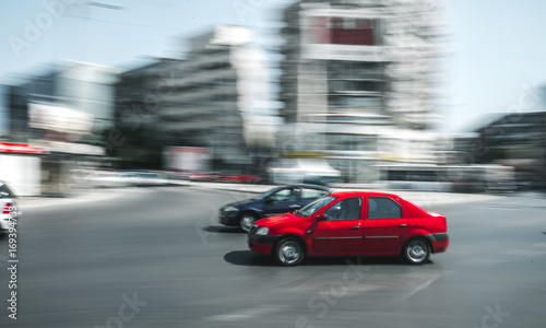 Red car in motion