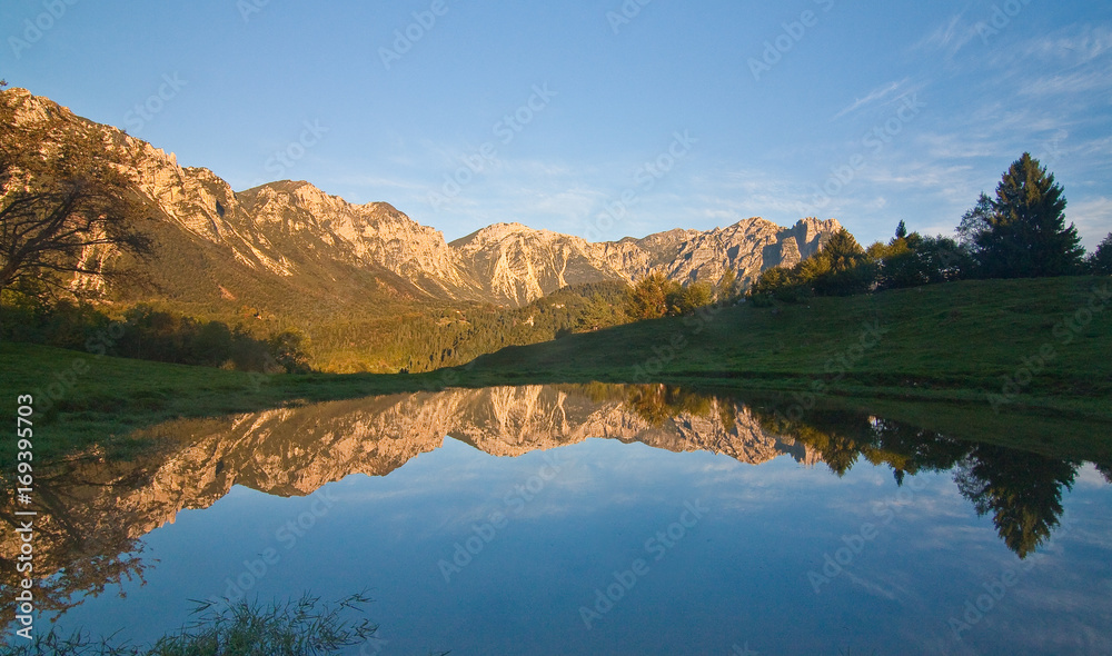 Recoaro 1000 mountains reflected in a pool of water Recoaro 1000 mountains reflected in a pool of water