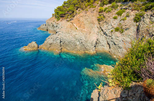 Cliffs in Bonassola, La Spezia province near 5 Terre, green and blue clean water of the mediterranean sea of ligurian east coast, Italy