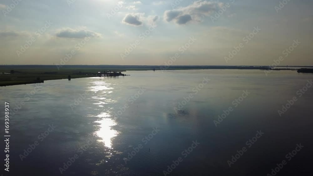 Aerial of a Dutch landscape and lake with cloud reflections on the water Aerial of a Dutch landscape and lake with cloud reflections on the water